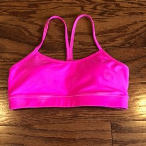Bright pink Lululemon sports bra